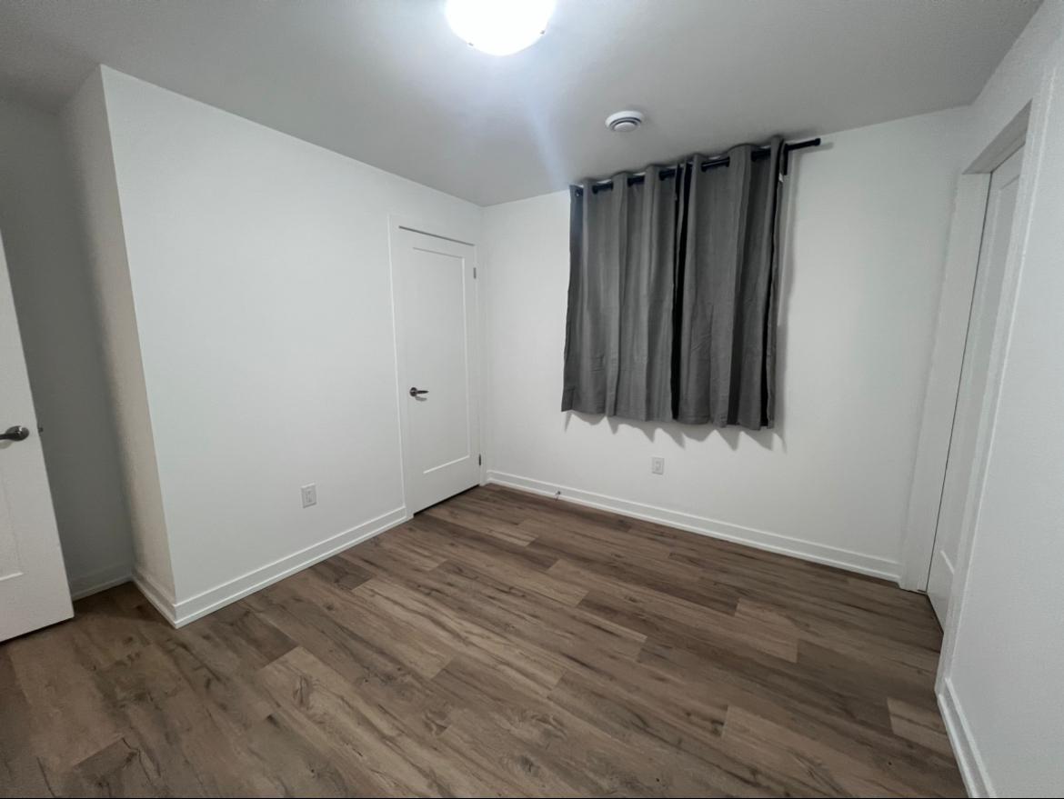 Second bedroom with a closet and window
